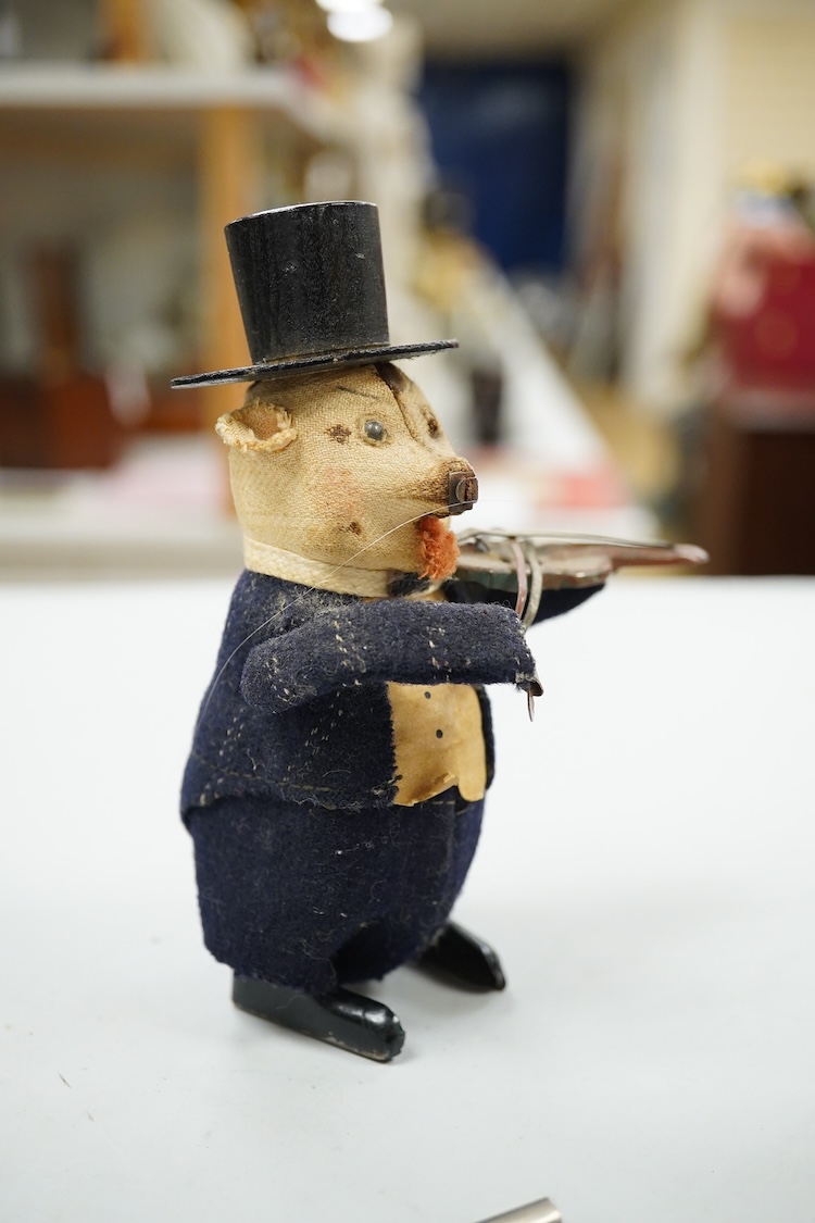 A Schuco felt clockwork pig violinist and key, 13cm high